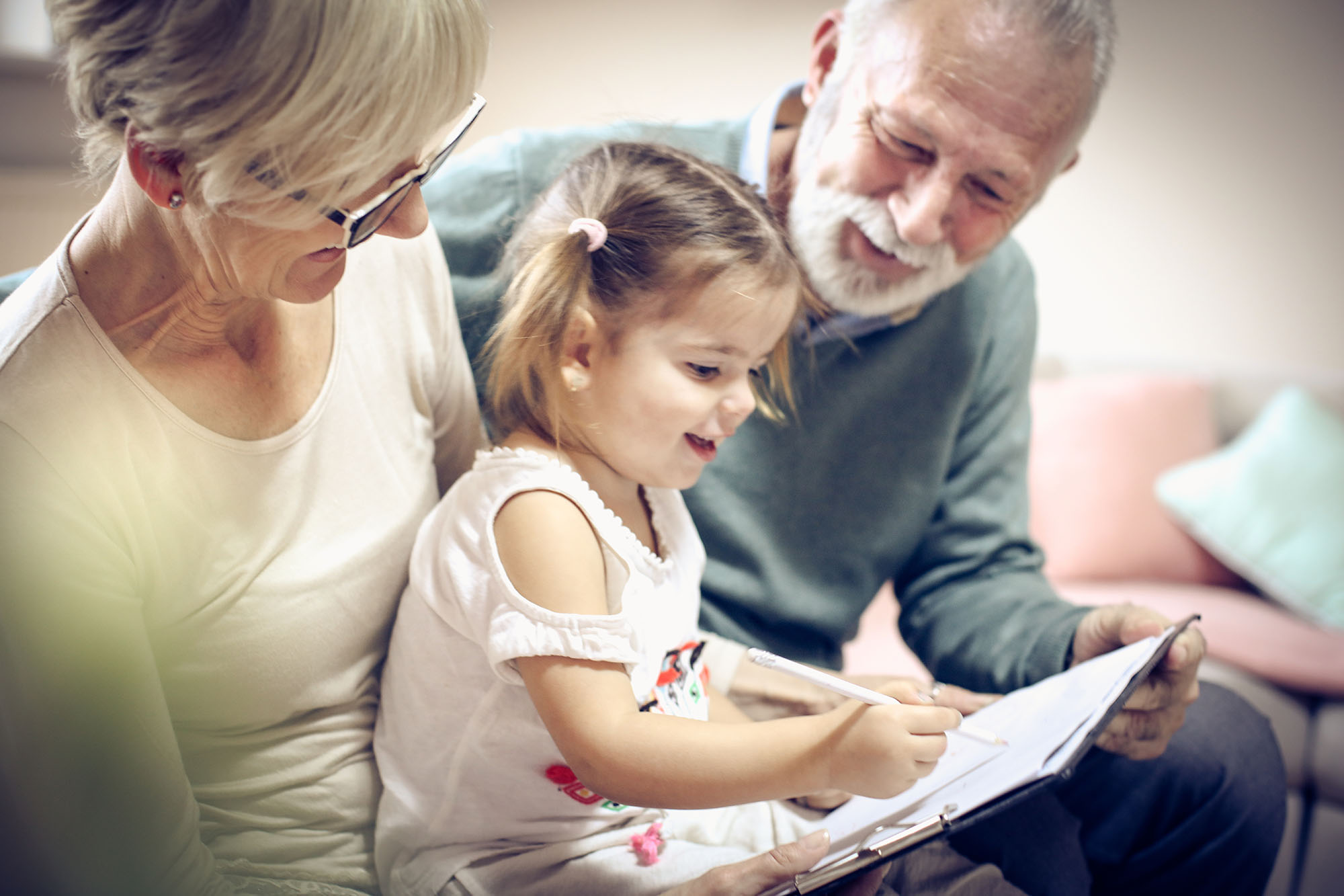 A grandfather and his two grandchildren