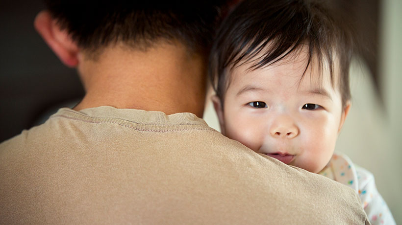 Father and baby in an embrace